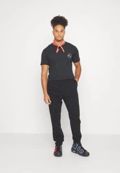 YOURTURN Unisex - Trainingsbroek - Black -Yourturn 4726d7ee4d5647f8a5f5c8ffe5554ff0